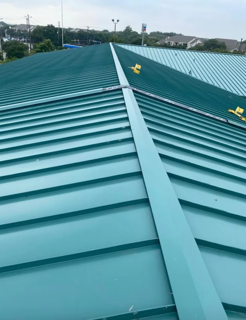 Green commercial metal roof ridge and valley for Metal Roof Repair in St. Peters